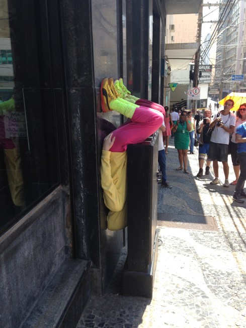 Observers watch a site specific work as part of the Bienal.