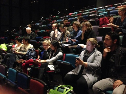 The ADR group preparing to watch Abraham.In.Motion in rehearsal (setting up headphones to listen to a specific piece of music while watching the work)